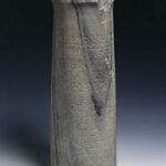 fragment de colonne grecque sur lequel est gravé un texte accompagné d'une notation musicale