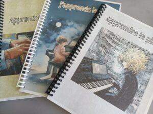 matériel pédagogique utilisé chez piano en liberté : livrets personnalisés regroupant les apprentissages de l'année